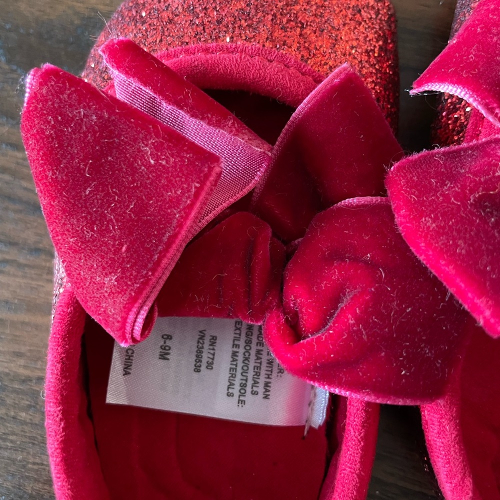 Adorable tiny red sparkly shoes. Worn one time.
